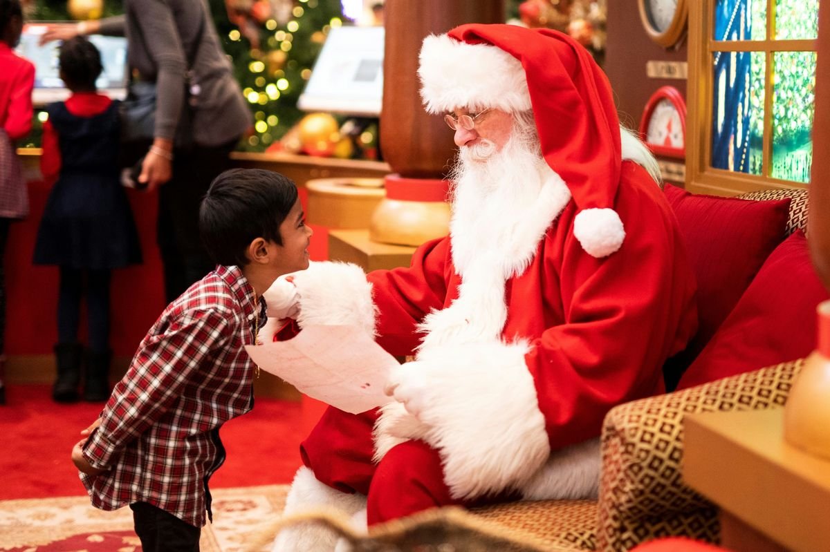 Child visiting Santa Claus in Lapland